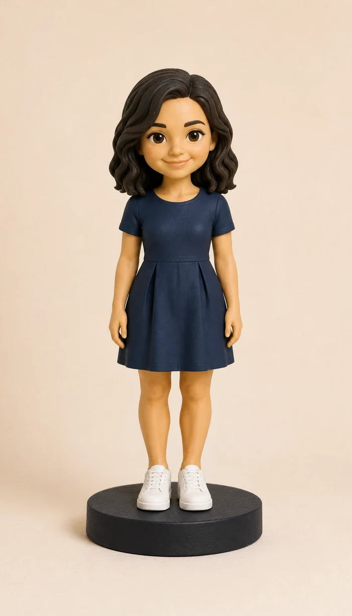 Sculpted-style blue-dress character illustration on a display base